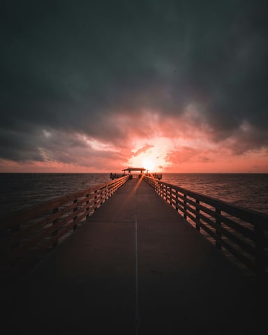 Fiery sunset over a Gulf Coast pier in Alabama